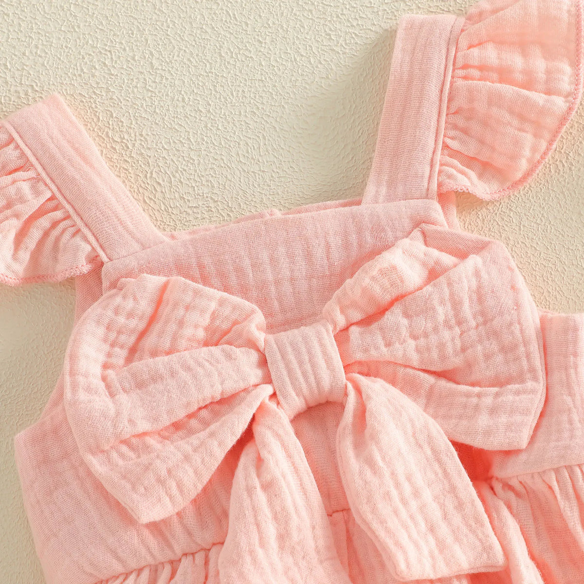 Nevah Bow & Flutter Romper - Peach
